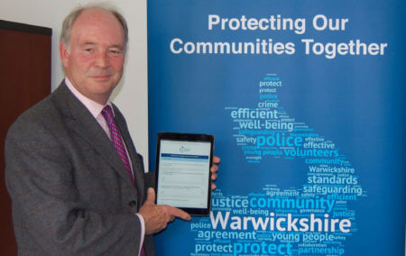 Warwickshire PCC Philip Seccombe with the Police and Crime Plan Consultation on an iPad.