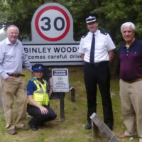 The new signs being put up on the roads into Binley Woods. From left, Paul Salisbury, Chair of Binley Woods Parish Council, PCSO Charlie Cawte and Superintendent David Gardner from Warwickshire Police and Steve Roberts, Parish Councillor responsible for Community Alerts and Safety.