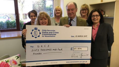 Presenting the cheque to staff at the Domestic Abuse Counselling Service in Bedworth.