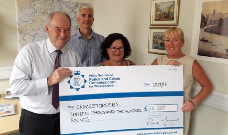 Warwickshire Police and Crime Commissioner hands over the funding to Crimestoppers representatives, from left, Warwickshire committee Vice Chair Rob Musgrove; Regional Manager Pauline Hadley and Senior Trust Manager Amanda Corcoran.