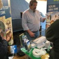 Design Out Crime Officer Mark English demonstrates a range of security devices suitable for agricultural premises at the farm event.