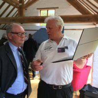 Richard Taylor of Automatrics shows Warwickshire Police and Crime Commissioner the 'Secured by Design' approved tracking system which can monitor vehicle locations via a laptop display.