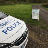 A police car at the entrance to the rural crime farm event.
