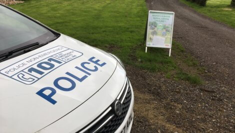 A police car at the entrance to the rural crime farm event.