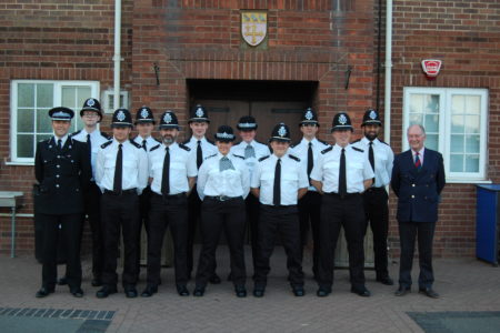 Assistant Chief Constable Alex Franklin Smith and Warwickshire Police and Crime Commissioner Philip Seccombe with the new police officers at their passing out ceremony at Warwick School