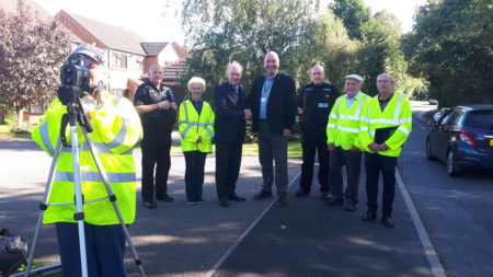 Pictured at Nether Whitacre is Community Speedwatch volunteer Carol Wallace (behind the speed camera), with, from left to right: PC Simon Ackroyd, Speedwatch co-ordinator Bev Woollaston, Police and Crime Commissioner Philip Seccombe, Cllr David Reilly, PC Simon Ackroyd and Community Speedwatch volunteers Arthur Harris and Steve Collins.