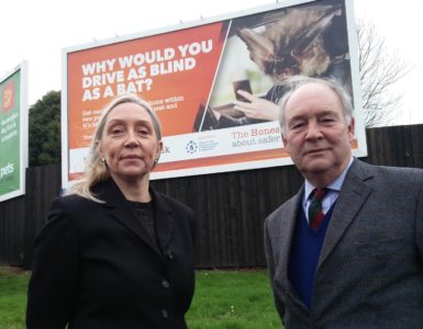 Annette LLoyd Head of The Honest Truth with PCC Philip Seccombe in front of one of the billboards