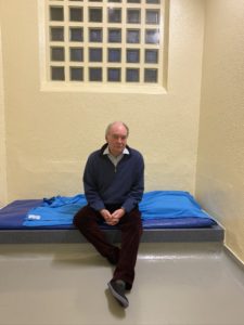 Philip Seccombe sitting in a cell at Leamington Police Station during his 'Night in Custody'