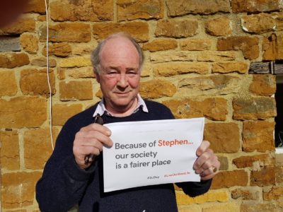 Warwickshire Police and Crime Commissioner Philip Seccombe with a Stephen Lawrence Day banner