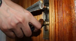 A hand trying a door handle