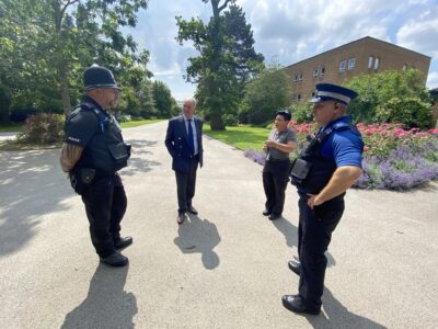 The Commissioner talks to members of the Safer Neighbourhood Team and a Town Warden during a walkabout in Rugby.