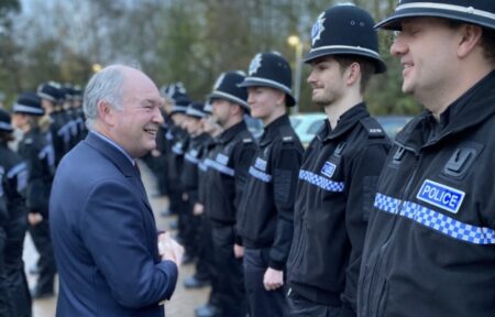 Police and Crime Commissioner Philip Seccombe talks to a line of police officers