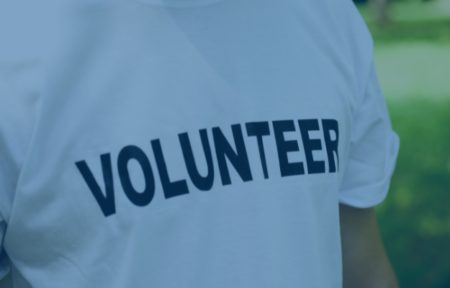 Close up of person wearing top saying volunteer