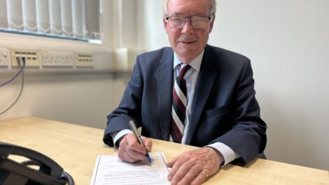 Philip Seccombe signs the oath of office